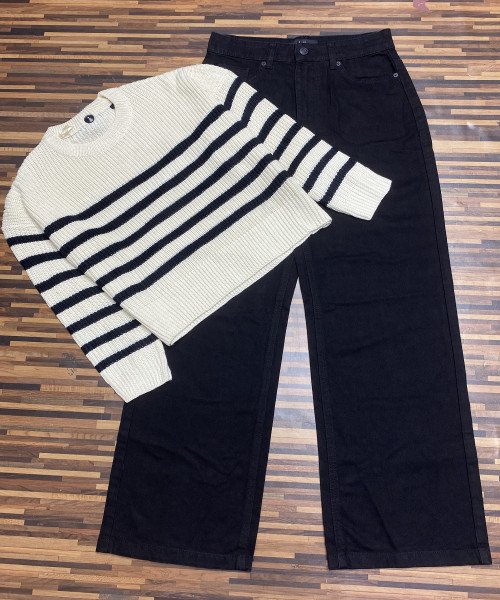 Black Jeans With White and Black Knitted Pullover